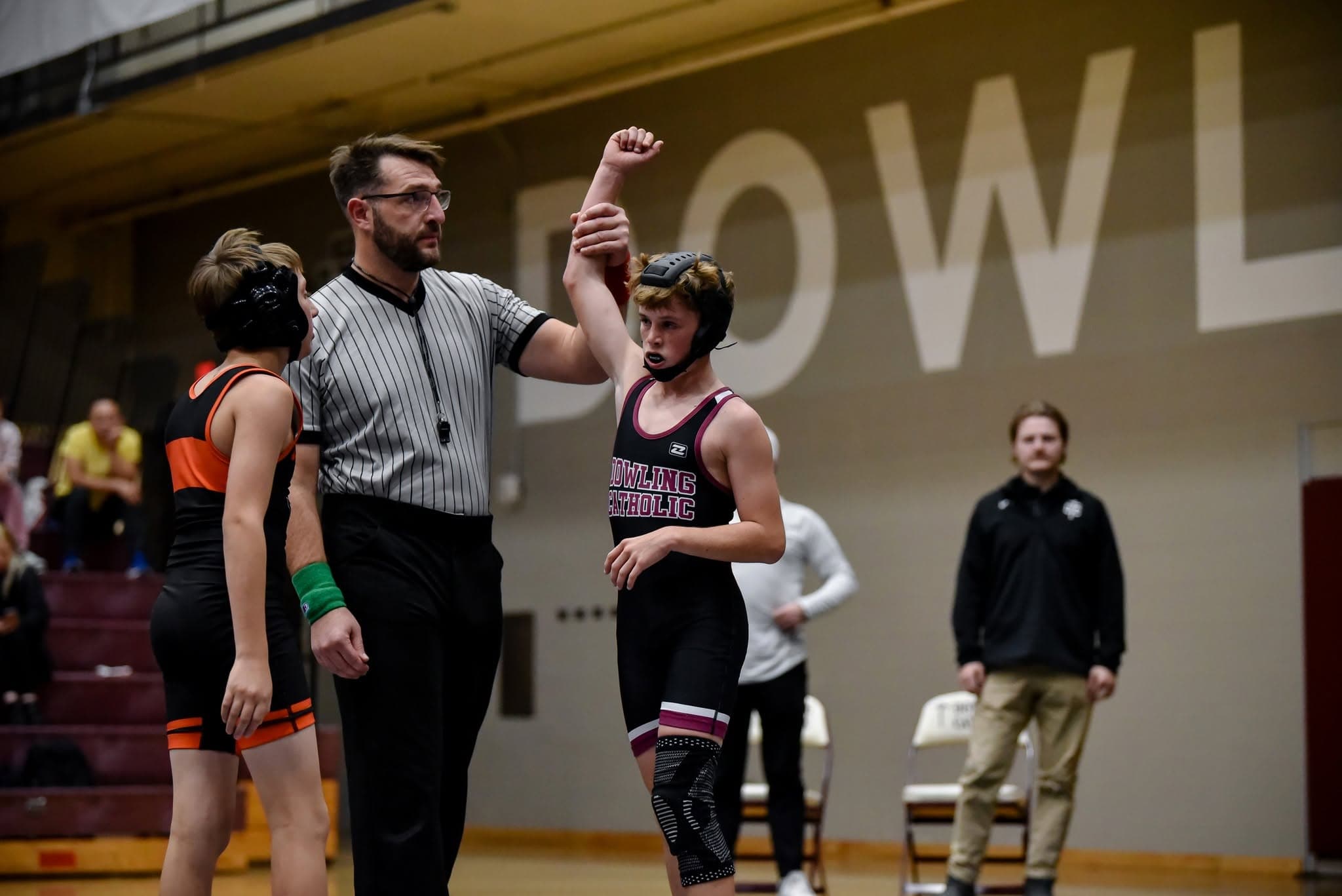 Wrestlers battling on the mat